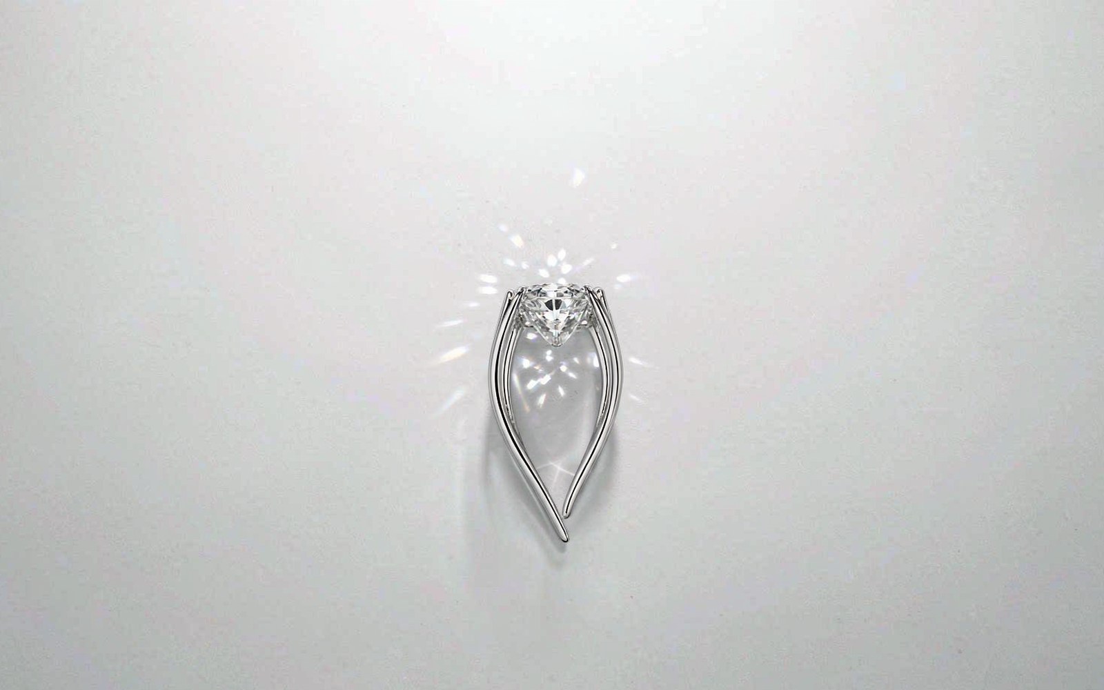 Moissanite solitaire ring on a light studio background